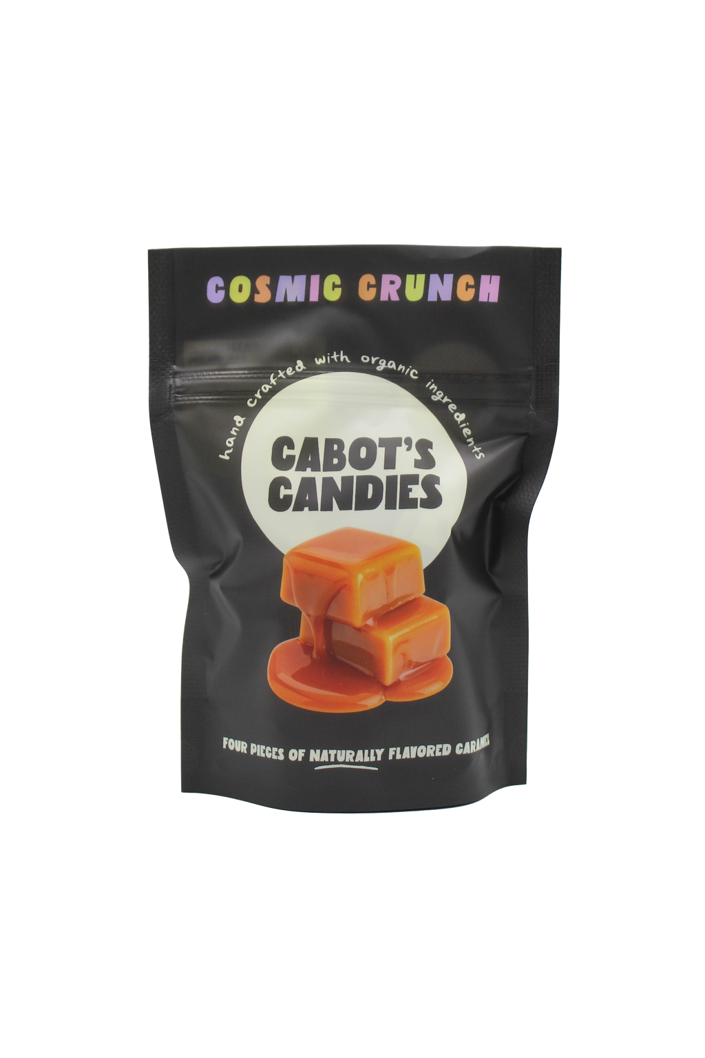 A black stand-up pouch of Cabot's Candies 'Cosmic Crunch' caramel candies, featuring a graphic of caramel squares on a white circle on the front, set against a plain white background.