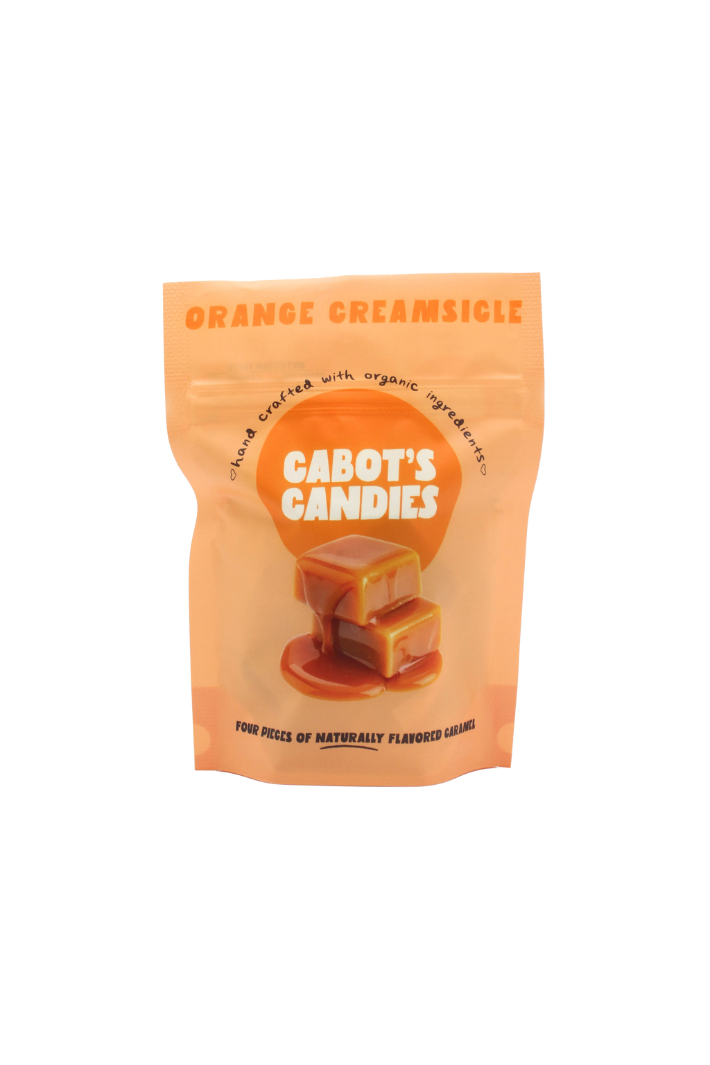 An orange stand-up pouch of Cabot's Candies Orange Creamsicle candy, featuring a graphic of two caramel candies on a white background.