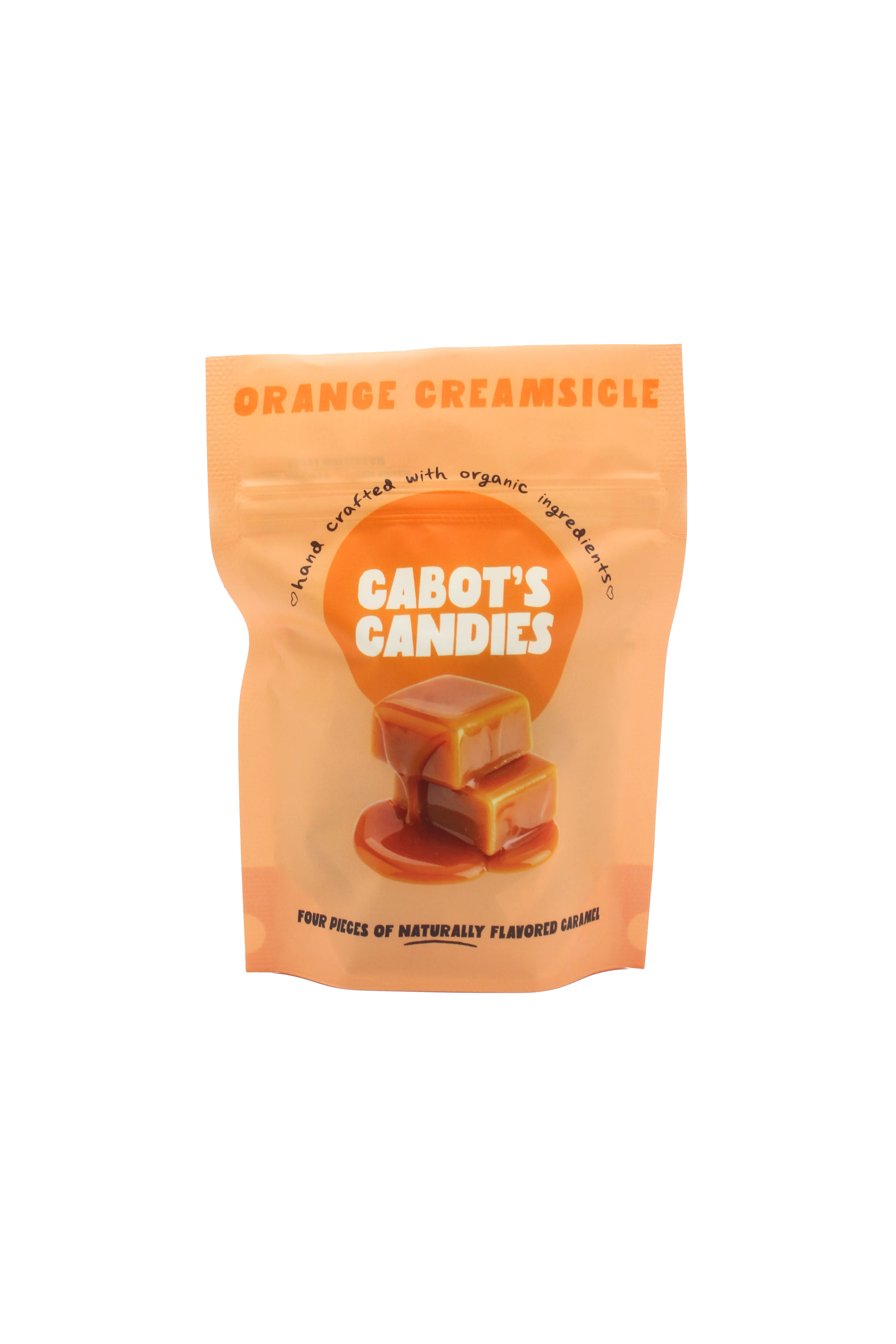 An orange stand-up pouch of Cabot's Candies Orange Creamsicle candy, featuring a graphic of two caramel candies on a white background.